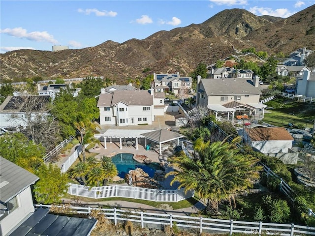 birds eye view of property featuring a mountain view