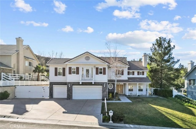 view of front of house with a garage and a front yard