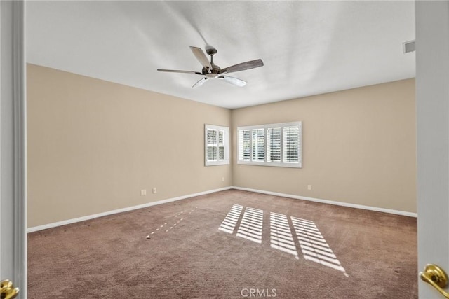 empty room featuring ceiling fan and carpet floors