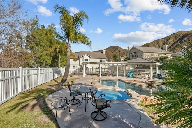 view of pool featuring a mountain view, a gazebo, a patio, and an in ground hot tub