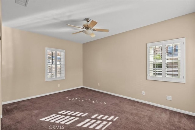 carpeted spare room with ceiling fan