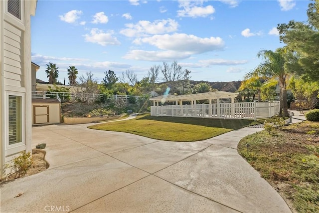 view of home's community with a pergola, a yard, and a patio