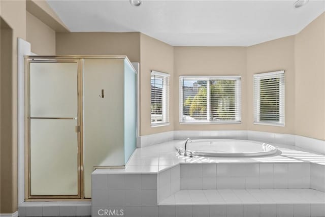 bathroom featuring plus walk in shower