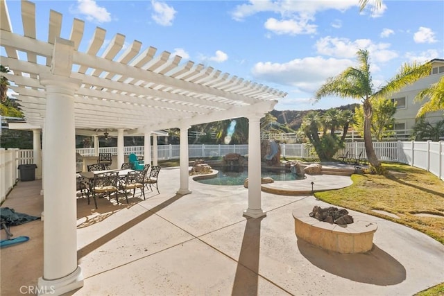 view of patio / terrace with a pergola, a fenced in pool, and a fire pit