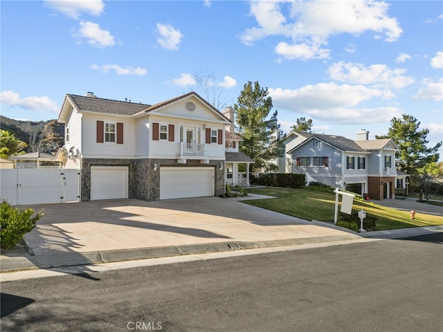 view of front of home featuring a garage and a front lawn