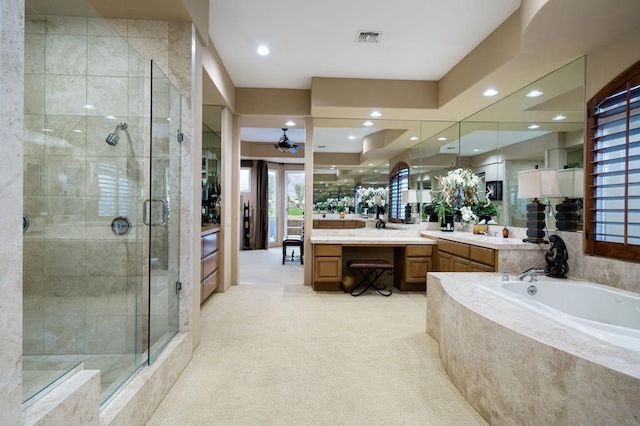 bathroom featuring separate shower and tub, ceiling fan, and vanity