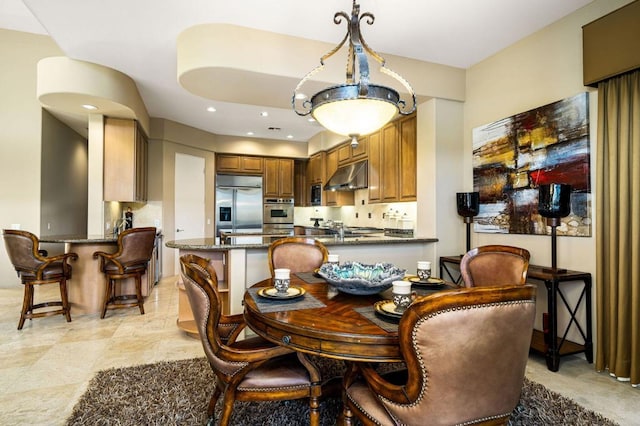 dining area featuring sink