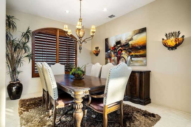 dining space with a notable chandelier