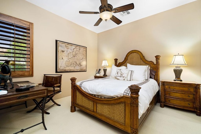 bedroom featuring light carpet and ceiling fan