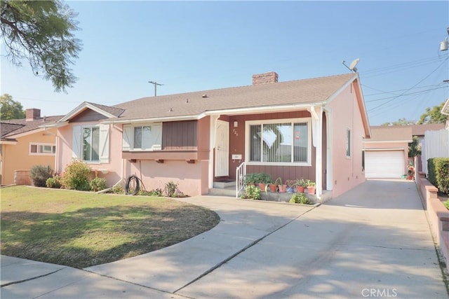 view of front facade with a garage and a front lawn