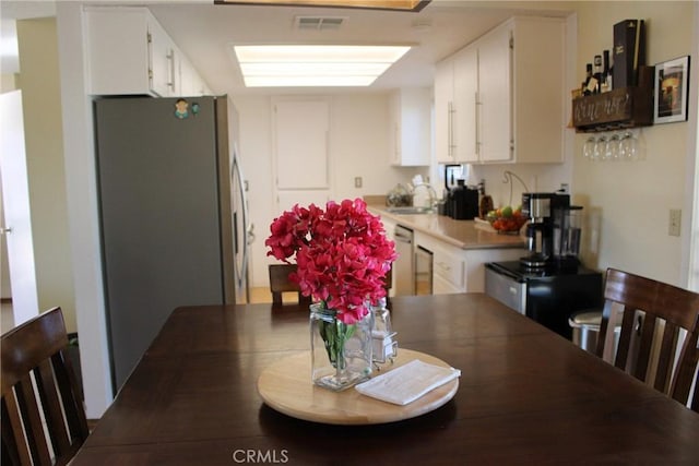 dining room featuring sink