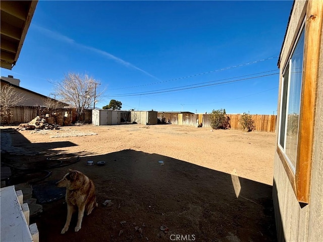 view of yard with a storage shed