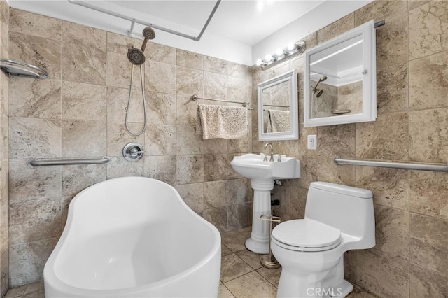 bathroom featuring a tub to relax in and toilet