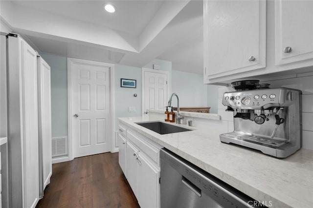 kitchen featuring dishwasher, white cabinetry, sink, and dark hardwood / wood-style flooring