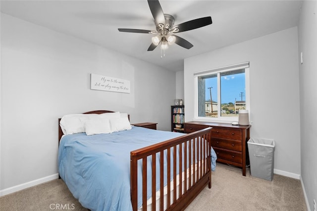 bedroom with light carpet and ceiling fan