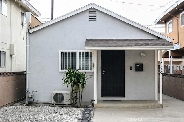 doorway to property featuring ac unit