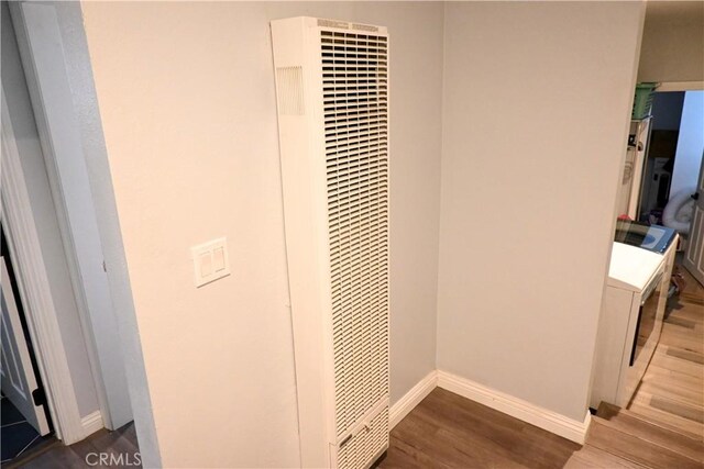 12530 Birch Ave, Hawthorne, CA 90250 - detailed view of a heating unit, wood finished floors, and washer / clothes dryer