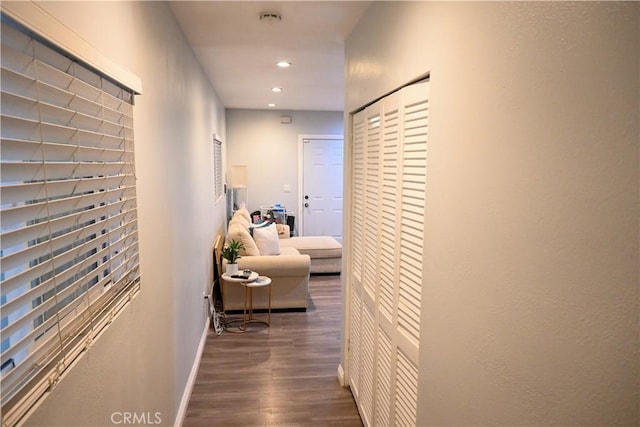 hallway featuring dark wood-type flooring