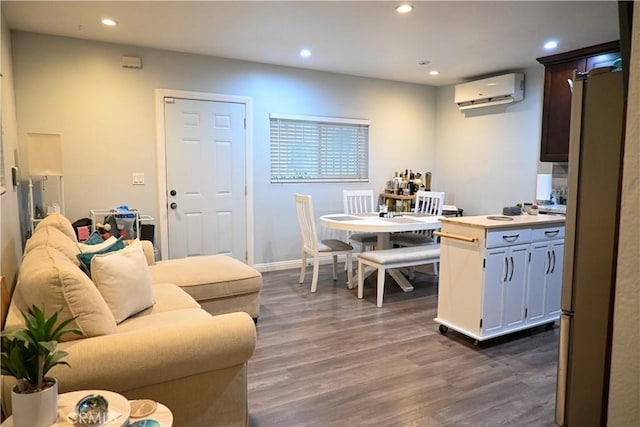 12530 Birch Ave, Hawthorne, CA 90250 - kitchen with a wall mounted AC, recessed lighting, dark wood-type flooring, and light countertops