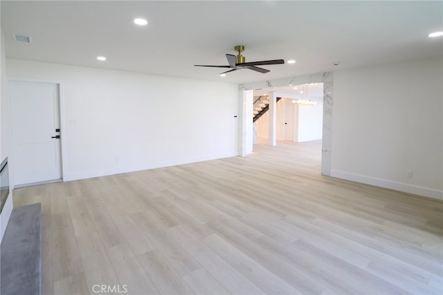 unfurnished room featuring light hardwood / wood-style flooring and ceiling fan