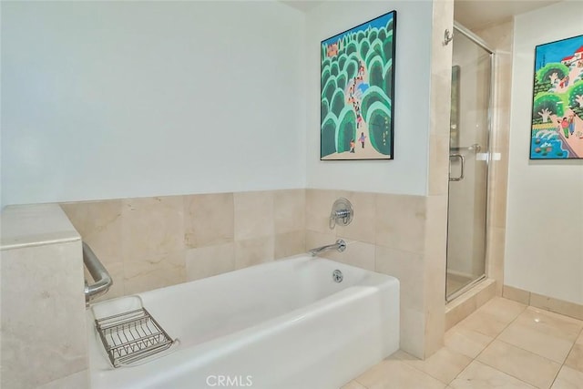 bathroom featuring plus walk in shower and tile patterned flooring