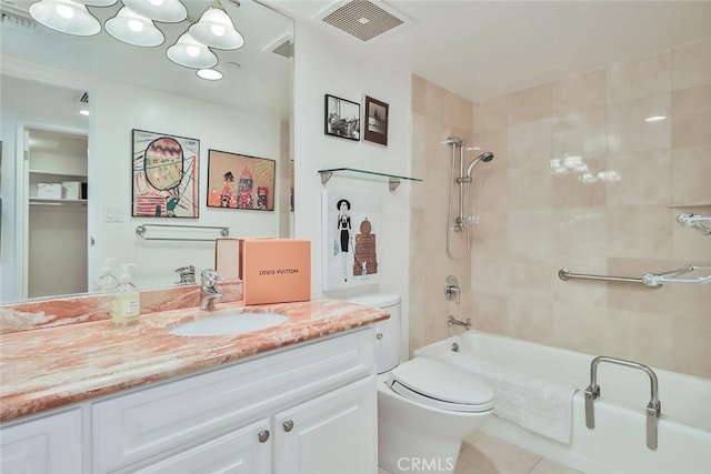 full bathroom with vanity, toilet, tile patterned floors, and tiled shower / bath combo