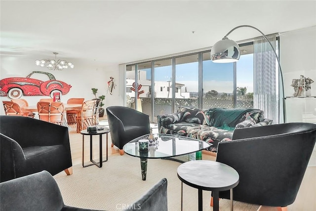 living room with hardwood / wood-style flooring, a wall of windows, and a notable chandelier