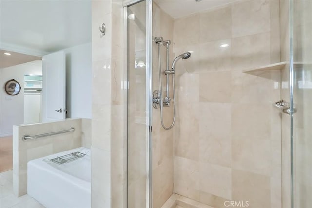 bathroom with a tile shower