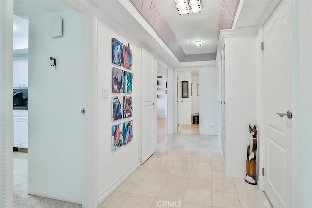 corridor with light tile patterned floors