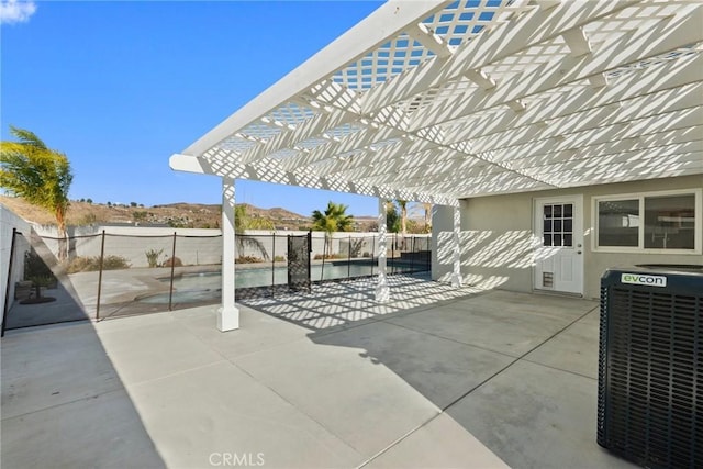 view of patio featuring central air condition unit and a pergola