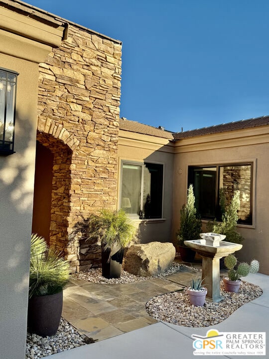 doorway to property featuring a patio