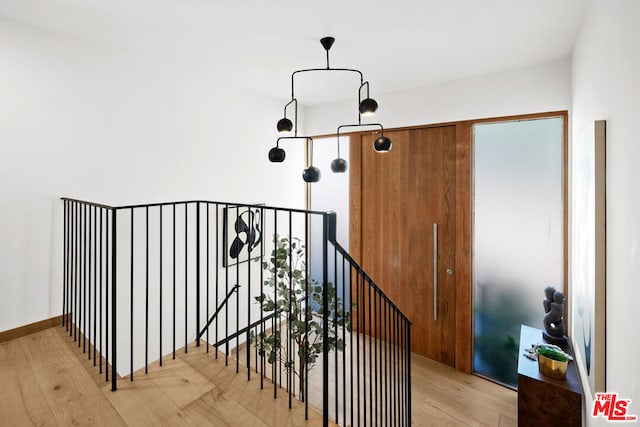 stairway featuring wood-type flooring