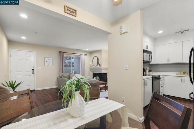 dining area featuring dark hardwood / wood-style flooring