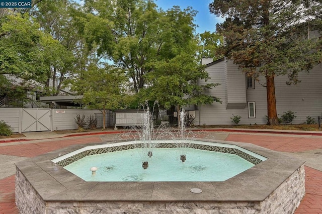 view of pool with pool water feature