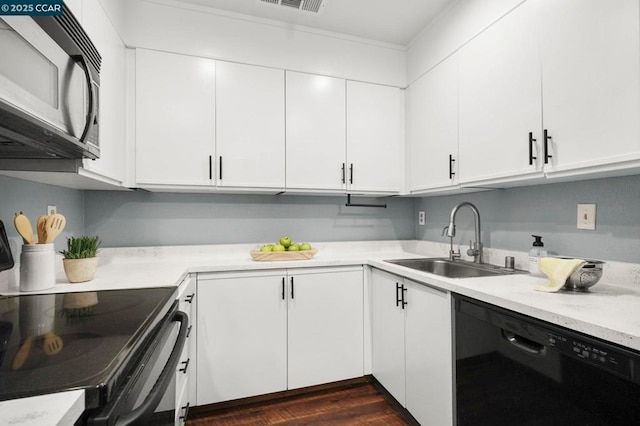 kitchen featuring black appliances, white cabinetry, dark wood-type flooring, and sink