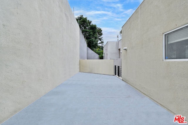 view of side of home with a patio area