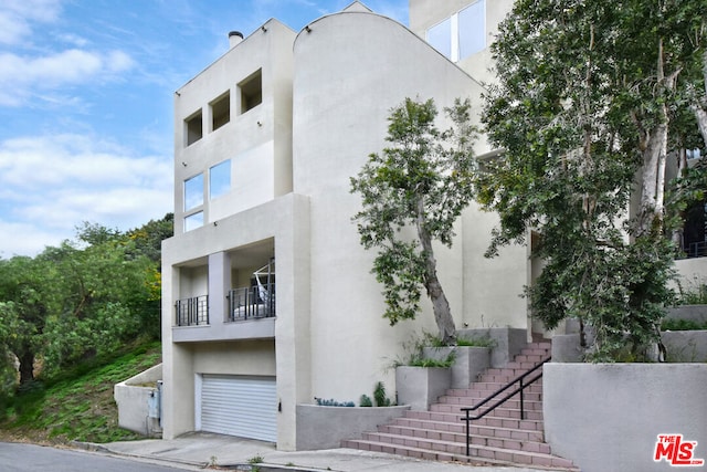 view of building exterior featuring a garage