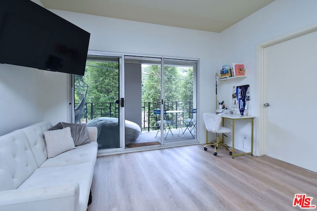 home office with light hardwood / wood-style floors