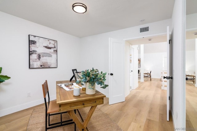 office area with light hardwood / wood-style flooring