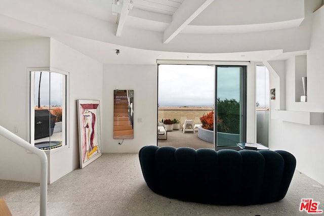 living room with beamed ceiling