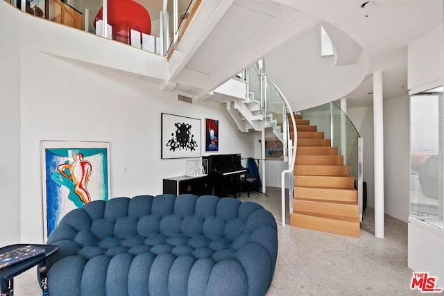 living room with beam ceiling