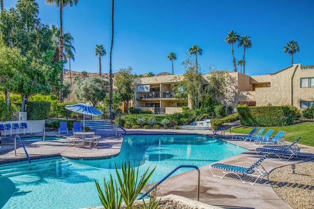 view of pool featuring a patio area