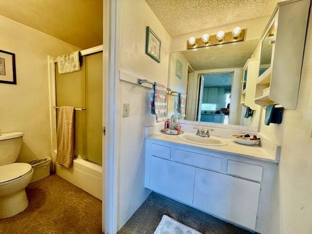 full bathroom with vanity, toilet, combined bath / shower with glass door, and a textured ceiling