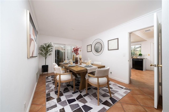 tiled dining area with ornamental molding