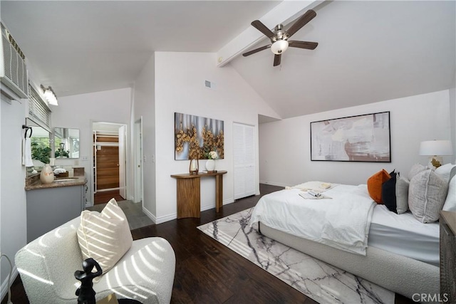 bedroom with ceiling fan, dark hardwood / wood-style floors, a closet, and vaulted ceiling with beams