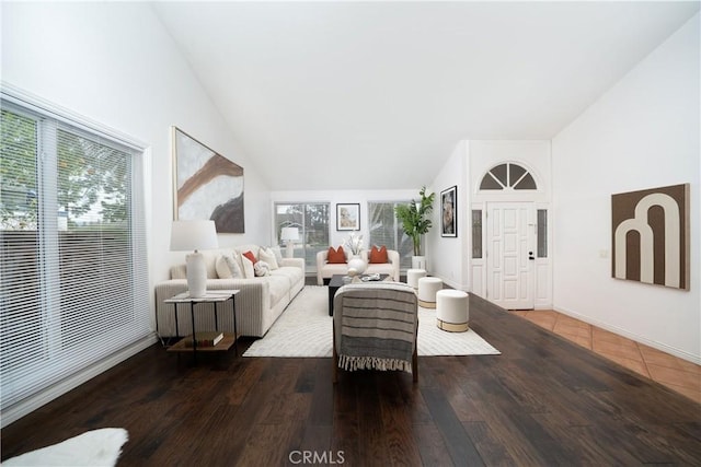 living room featuring dark hardwood / wood-style floors and high vaulted ceiling