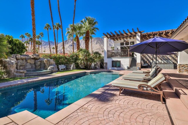 view of pool featuring a mountain view, a patio, and a pergola