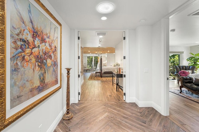 hallway featuring parquet flooring