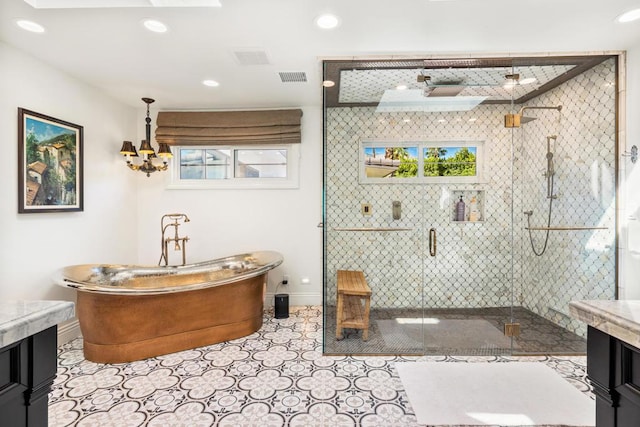 bathroom with tile patterned flooring, vanity, and shower with separate bathtub