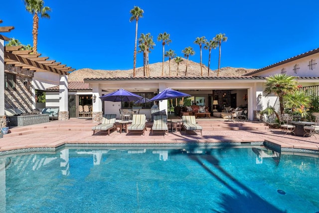 view of pool with a patio area and a pergola